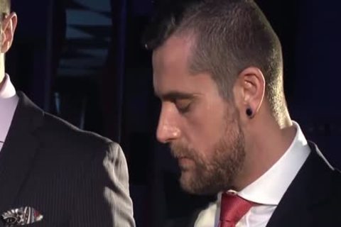 Two males In Suits Meet In A Bar