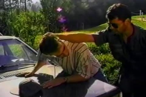 brunette hair man Is slammed Hard On The Hood Of His Car