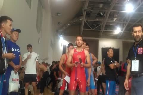 Middle Eastern teens Weigh-in before Wrestling Tournament